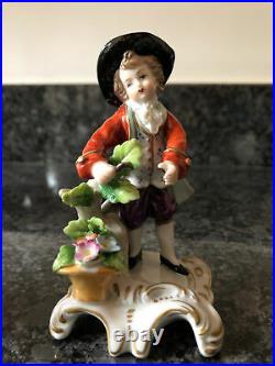 A Pair of German Sitzendorf Porcelain Figurines Boy & Girl With Flower Baskets