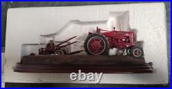 BORDER FINE ARTS'MAKING ADJUSTMENTS' A2142 McCormick Farmall Tractor Boxed