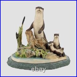Otters On A Stone Base Border Fine Arts