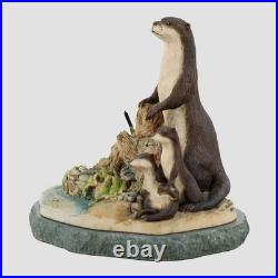 Otters On A Stone Base Border Fine Arts