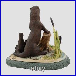 Otters On A Stone Base Border Fine Arts